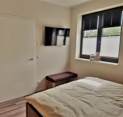 Ein Bett oder Betten in einem Zimmer der Unterkunft Kleine-Ostseeliebe