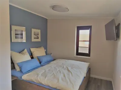 Ein Bett oder Betten in einem Zimmer der Unterkunft Kleine-Ostseeliebe 2