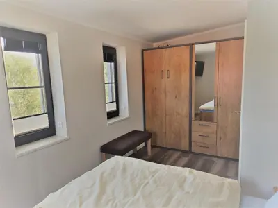 Ein Bett oder Betten in einem Zimmer der Unterkunft Kleine-Ostseeliebe 2