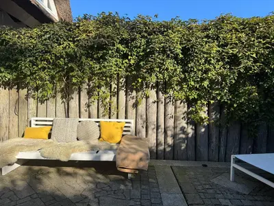 Ein Garten an der Unterkunft Ferienhäuser Doppelhaushälfte am Grenzweg