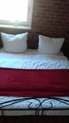 Ein Bett oder Betten in einem Zimmer der Unterkunft Ferienhaus Möwe