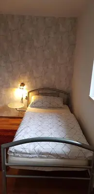 Ein Bett oder Betten in einem Zimmer der Unterkunft Ferienhaus Möwe