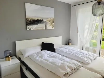 Ein Bett oder Betten in einem Zimmer der Unterkunft Haus Seeschwalbe, Whg 2