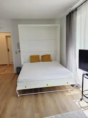 Ein Bett oder Betten in einem Zimmer der Unterkunft Haus Seeschwalbe, Whg 2