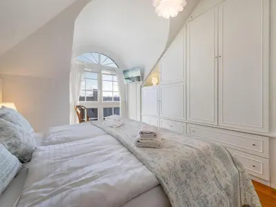 Ein Bett oder Betten in einem Zimmer der Unterkunft Villa Deigraf-Whg 9 Niehagen