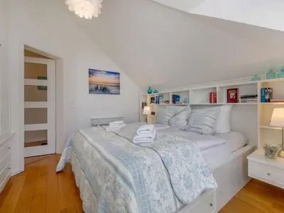Ein Bett oder Betten in einem Zimmer der Unterkunft Villa Deigraf-Whg 9 Niehagen