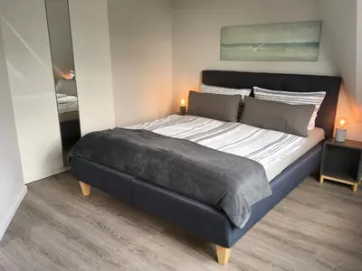 Ein Bett oder Betten in einem Zimmer der Unterkunft Ferienhaus Strandnah