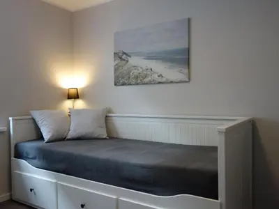 Ein Bett oder Betten in einem Zimmer der Unterkunft Ferienhaus Strandnah