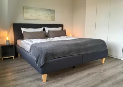 Ein Bett oder Betten in einem Zimmer der Unterkunft Ferienhaus Strandnah