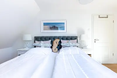 Ein Bett oder Betten in einem Zimmer der Unterkunft Parkliebe 7