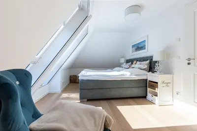Ein Bett oder Betten in einem Zimmer der Unterkunft Parkliebe 7