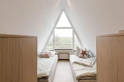 Ein Bett oder Betten in einem Zimmer der Unterkunft Refugium zum Hohen Ufer 