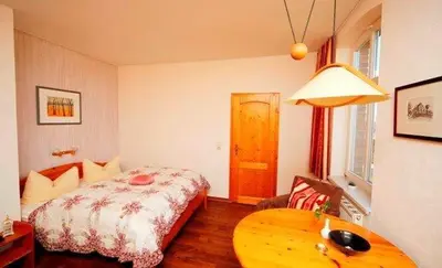 Ein Bett oder Betten in einem Zimmer der Unterkunft Hotel/Pension Bradhering