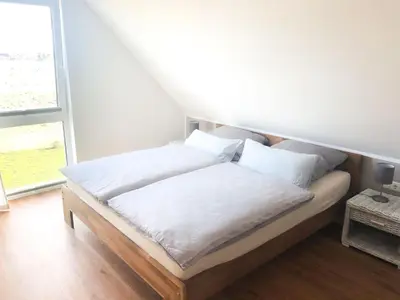 Ein Bett oder Betten in einem Zimmer der Unterkunft Ferienhaus Redensee