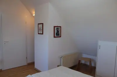 Ein Bett oder Betten in einem Zimmer der Unterkunft Ferienwohnung Sünnenkringel 58
