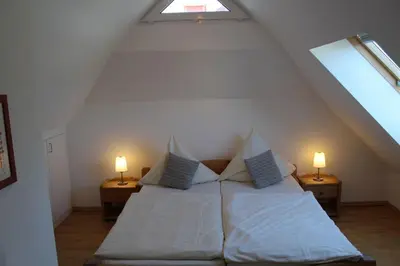 Ein Bett oder Betten in einem Zimmer der Unterkunft Ferienwohnung Sünnenkringel 58