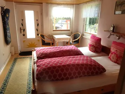 Ein Bett oder Betten in einem Zimmer der Unterkunft Fewo am Rosengarten