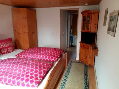 Ein Bett oder Betten in einem Zimmer der Unterkunft Fewo am Rosengarten