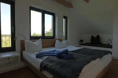 Ein Bett oder Betten in einem Zimmer der Unterkunft SandKorn 1 und 2