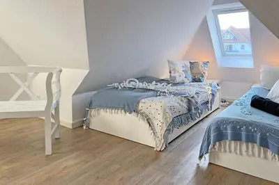 Ein Bett oder Betten in einem Zimmer der Unterkunft Strandwild