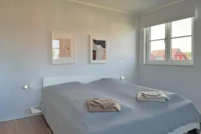 Ein Bett oder Betten in einem Zimmer der Unterkunft Luv - Mehr am Meer