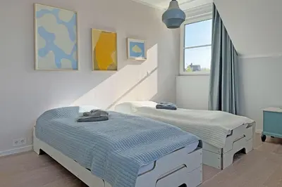 Ein Bett oder Betten in einem Zimmer der Unterkunft Luv - Mehr am Meer