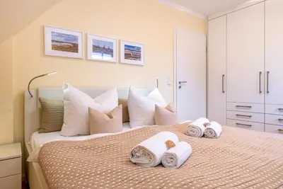 Ein Bett oder Betten in einem Zimmer der Unterkunft Ferienhaus Zingst