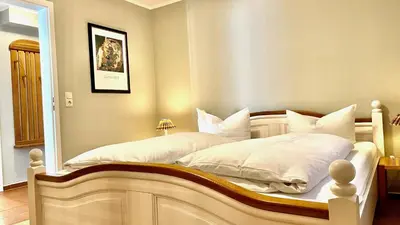 Ein Bett oder Betten in einem Zimmer der Unterkunft Haus Strandgut FW 7