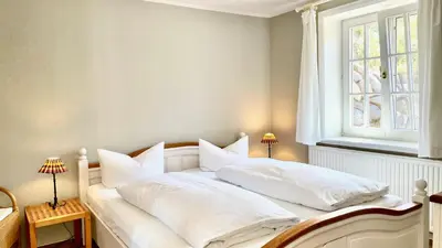 Ein Bett oder Betten in einem Zimmer der Unterkunft Haus Strandgut FW 7