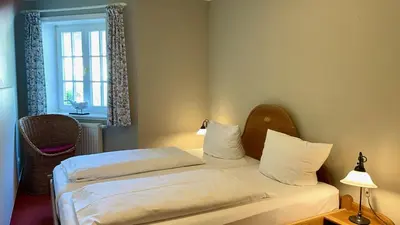 Ein Bett oder Betten in einem Zimmer der Unterkunft Haus Strandgut FW 2