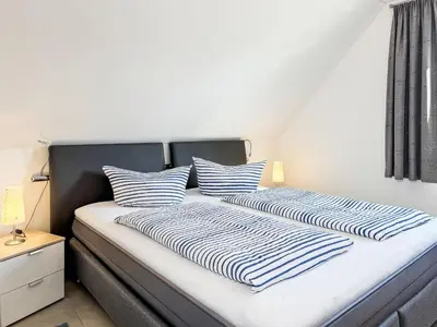 Ein Bett oder Betten in einem Zimmer der Unterkunft Passatwind