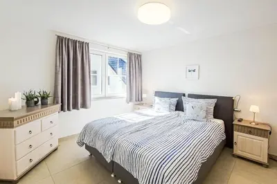 Ein Bett oder Betten in einem Zimmer der Unterkunft Passatwind