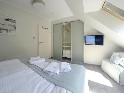 Ein Bett oder Betten in einem Zimmer der Unterkunft Ferienwohnung Ostseereif WE51