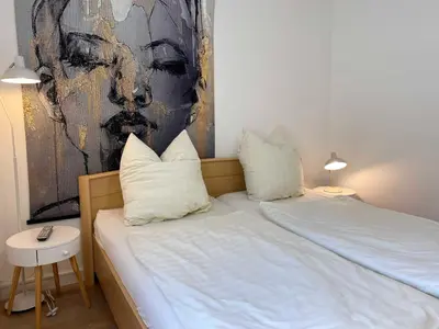 Ein Bett oder Betten in einem Zimmer der Unterkunft Dat Gele Hus Wohnung 2