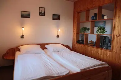 Ein Bett oder Betten in einem Zimmer der Unterkunft Ferienwohnungen Pachal