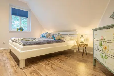 Ein Bett oder Betten in einem Zimmer der Unterkunft Kapitäns Hus