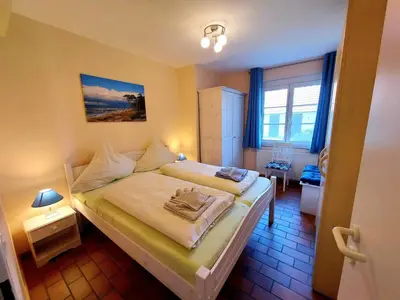 Ein Bett oder Betten in einem Zimmer der Unterkunft MeerZeit