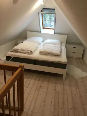 Ein Bett oder Betten in einem Zimmer der Unterkunft Weststrand-Idylle