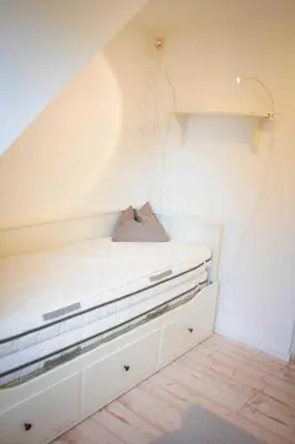 Ein Bett oder Betten in einem Zimmer der Unterkunft Weststrand-Idylle