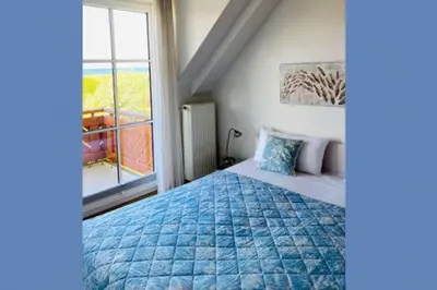Ein Bett oder Betten in einem Zimmer der Unterkunft Birkenhof App 17, Käpt´n Suite