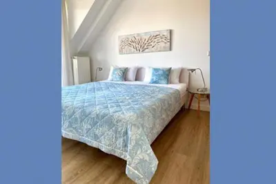 Ein Bett oder Betten in einem Zimmer der Unterkunft Birkenhof App 17, Käpt´n Suite