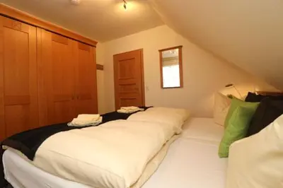 Ein Bett oder Betten in einem Zimmer der Unterkunft Oewern Diek App 05