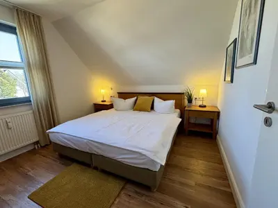 Ein Bett oder Betten in einem Zimmer der Unterkunft Oewern Diek App 31