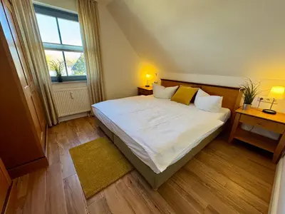 Ein Bett oder Betten in einem Zimmer der Unterkunft Oewern Diek App 31