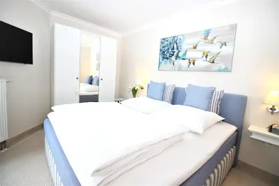 Ein Bett oder Betten in einem Zimmer der Unterkunft StorchenSuite - Zingst