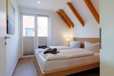 Ein Bett oder Betten in einem Zimmer der Unterkunft Suite Strandrose