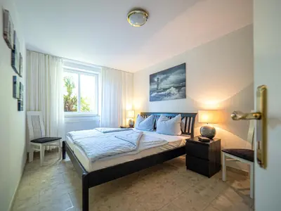 Ein Bett oder Betten in einem Zimmer der Unterkunft Birkenstrasse 6i Wohnung 14