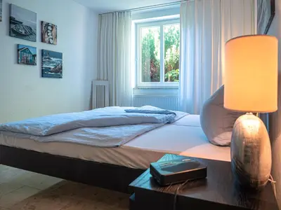 Ein Bett oder Betten in einem Zimmer der Unterkunft Birkenstrasse 6i Wohnung 14