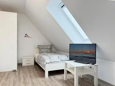 Ein Bett oder Betten in einem Zimmer der Unterkunft Boddenblick 9