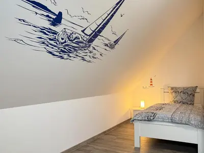 Ein Bett oder Betten in einem Zimmer der Unterkunft Boddenblick 9